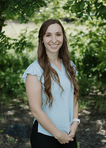 Rylee Sutton smiles at the camera.
