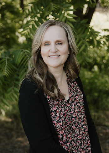Jill Jimenez smiles at the camera.
